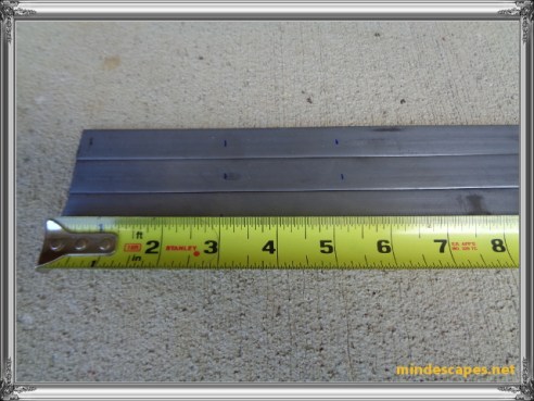 tape measure showing markings on the 3 steel strips at 3 inches and 5 and 1/4 inches
